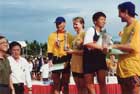 Jenny & Warick from PDs accepting award-watched by coach Daly Chan